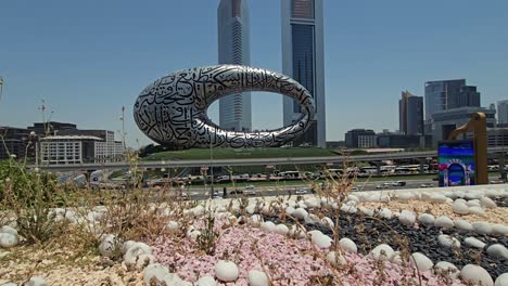 A-stunning-view-of-Dubai's-Museum-of-the-Future,-along-with-Sheikh-Zayed-Road-and-city-traffic