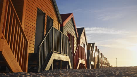 Muizenberg-Beach-Huts-During-Sunrise---Slow-Pan-Shot