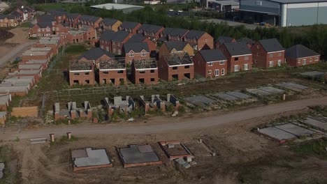 Residential-housing-framework-aerial-view-establishing-unfinished-rooftop-development-on-urban-building-site-real-estate