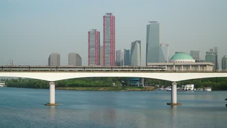 Trains-Traveling-Through-Dangsan-Railway-Bridge-Cross-The-Han-River-in-Seoul,-South-Korea