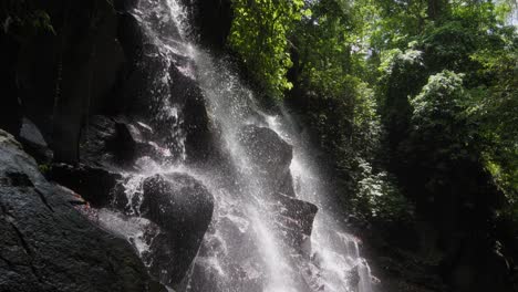 beautifully-illuminated-Kanto-Lampo-Waterfall-in-Bali,-Indonesia