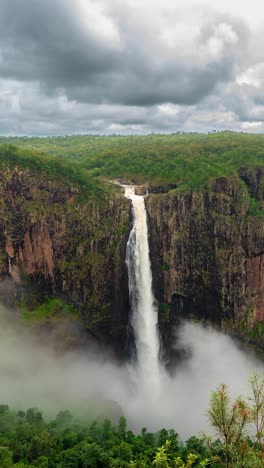 Vertical-4k-Timelapse,-Wallaman-Falls,-Queensland,-Australia,-Natural-Landmark-and-Landscape-Under-Low-Clouds