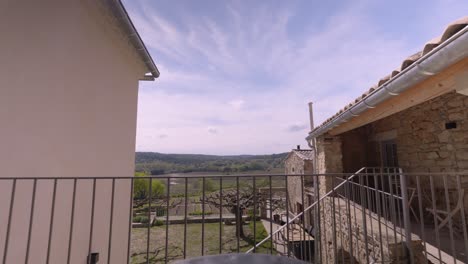 Slow-establishing-shot-of-wicker-chairs-on-a-villa-balcony-in-Tresques