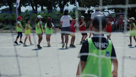 Establishing-shot-of-teams-playing-handball-on-a-sports-day-in-summer