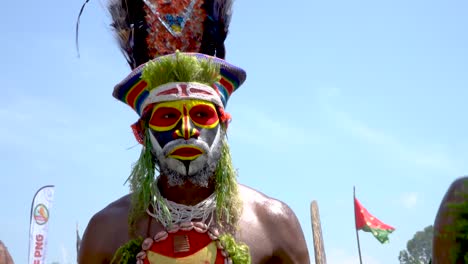 Man-with-feather-headdress-and-face-paint-of-Papua-New-Guinea-highlands