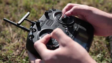 Hands-Operating-a-Remote-Control-For-a-Drone---Close-Up