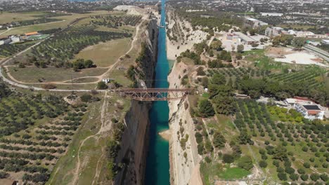 Bridge-Over-The-Corinth-Canal-In-Greece-With-Portion-Of-Collapsed-Limestone-Wall-Revealed