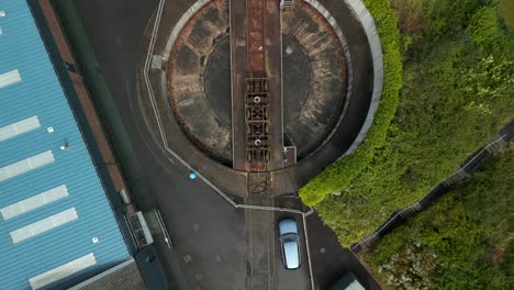 Aerial-of-a-vintage-railway-station-in-Whitehead,-Northern-Ireland