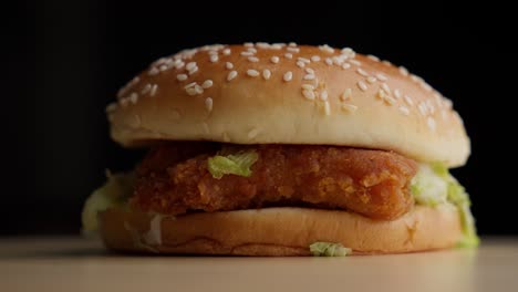 Closeup-shot-rotating-Fried-Chicken-burger,-mayo,-lettuce-studio-background