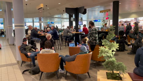 Crowd-of-people-passing-by-at-a-convention-in-a-conference-hall-at-Bodo-airport-Nordland-Northern-norway