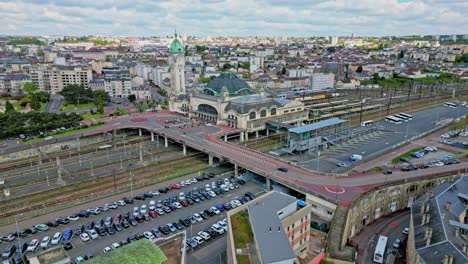 Limoges-Benedictins-station,-France.-Aerial-forward-ascending-and-cityscape