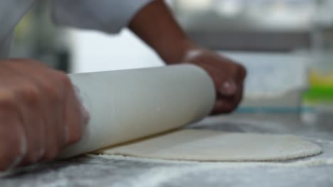 A-chief-Kneads-the-dough-to-make-Italian-pizza,-close-up-shot,-insert-shot