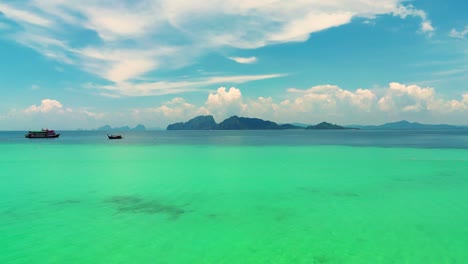 4K-Cinematic-nature-drone-footage-of-a-panoramic-aerial-view-of-the-beautiful-beaches-and-islands-surrounding-the-island-of-Koh-Lanta-in-Krabi,-South-Thailand,-on-a-sunny-day