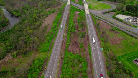 Aerial-view-of-Interstate-I-80-with-dry-van-and-reefer-trucks-in-motion