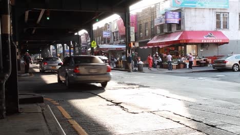 Busy-urban-street-at-Brighton-Beach-in-Brooklyn,-New-York-City-on-a-sunny-day