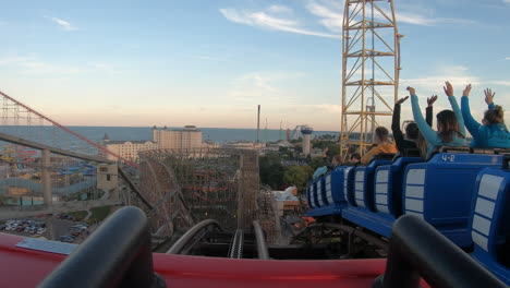 Front-seat-view-POV-of-double-roller-coaster-going-down-on-a-steep-drop