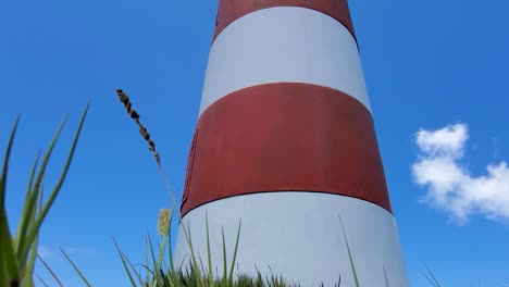 Close-up-red-and-white-Lighthouse-in-Cayo-de-Agua-island,-Los-Roques-Venezuela,