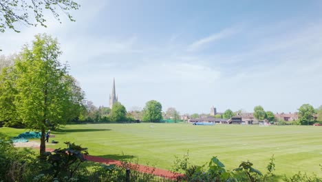 View-of-Norwich-cathedral-spire-over-school-sports-playing-field