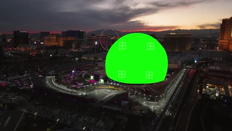 Aerial-view-of-the-Green-screen-Sphere-arena,-colorful-evening-in-Las-Vegas,-USA