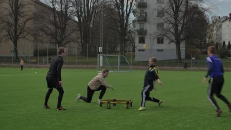 Roundnet-played-by-young-guys-at-sunny-day,-in-Sweden-Gothenburg