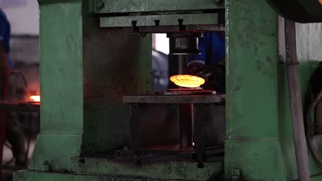close-up-seen-where-forging-is-taking-place-inside-the-hot-strip-machine,-Industrial-safety-first-concept