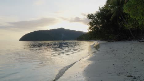 Deserted-beach-on-Kri-island,-Raja-Ampat-archipelago,-New-Guinea-in-Indonesia