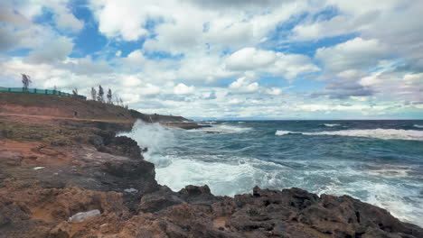 A-coastal-view-of-Cyprus-showing-rocky-cliffs-with-waves-crashing-against-them