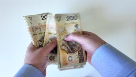 Close-up-view-businessman-hands-counting-money