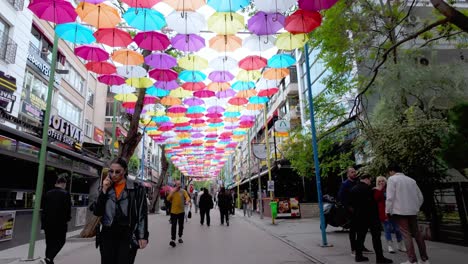 Ankara,-Türkiye:-Strolling-down-one-of-Ankara's-most-colorful-streets,-covered-with-vibrant-umbrellas