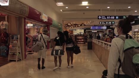 Girl-at-Cancun-International-airport-with-a-suitcase