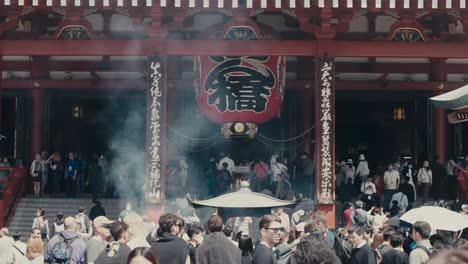 Tourists-At-The-Sensoji-Main-Hall,-Buddhist-Temple-in-Asakusa,-Tokyo,-Japan