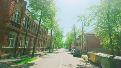 Swirly-finky-houses-and-apartments-during-summer-in-Dutch-angle-forward-pov-in-Eastern-European-city-Daugavpils,-Latgola,-Latvla,-Batlic