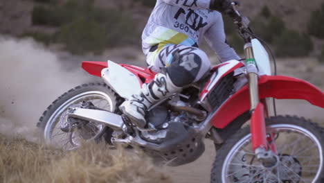 slowmotion-of-dirt-biker-riding-through-a-turn-while-spraying-dirt-#2