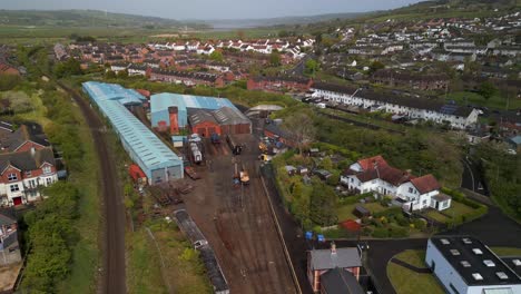 Aerial-of-a-vintage-railway-station-in-Whitehead,-Northern-Ireland