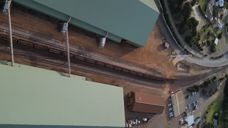 Long-cargo-train-wagons-loaded-with-iron-in-Esperance-port-area,-Western-Australia