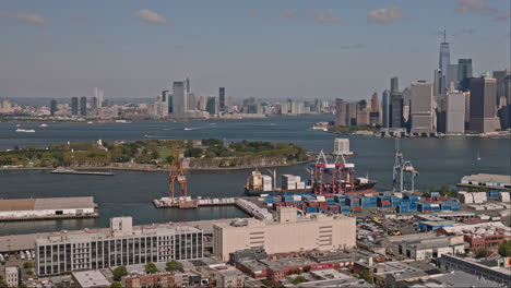 NYC-New-York-Aerial-v199-flyover-Brooklyn-waterfront-district-capturing-shipyard-facilities,-Governors-Island,-Jersey-city-and-Manhattan-downtown-cityscape---Shot-with-Inspire-3-8k---September-2023