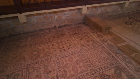 A-close-up-of-the-geometric-mosaic-patterns-on-the-floor-of-the-House-of-Dionysus,-showcasing-the-detailed-and-intricate-designs