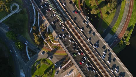 Overhead-View-Of-Cars-Driving-Through-The-Narrows-Bridge-And-Highway-In-Perth,-Western-Australia