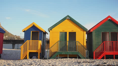 Muizenberg-Beach-Huts-During-Sunrise---Panning-Shot