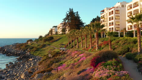 Aerial-Along-Puerto-Velero-Beach,-Garden-Path-During-Sunset