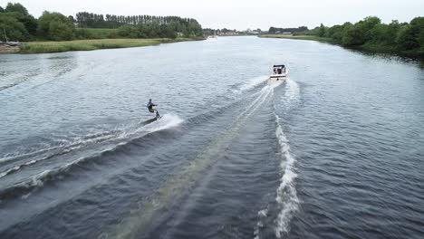 Aerial-View-of-Water-Skier-and-Tow-Boat,-60fps