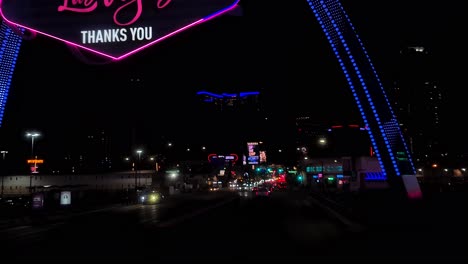 Las-Vegas-Nevada-USA,-Driving-Under-Strip-Landmark-Arch-Sign-in-Lights,-The-City-of-Las-Vegas-Thanks-You