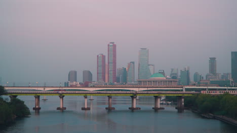 Yanghwa-Bridge-And-Dangsan-Railway-Bridge-Over-Hangang-River-At-Sunset-In-Seoul,-South-Korea