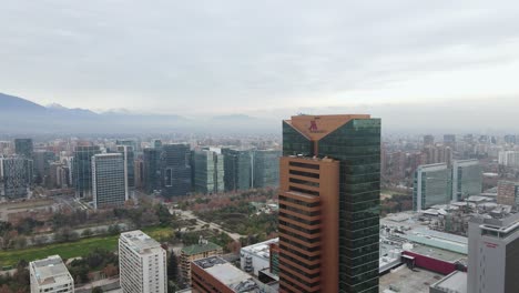 Aerial-going-backwards-revealing-hotel-building-and-the-cityscape