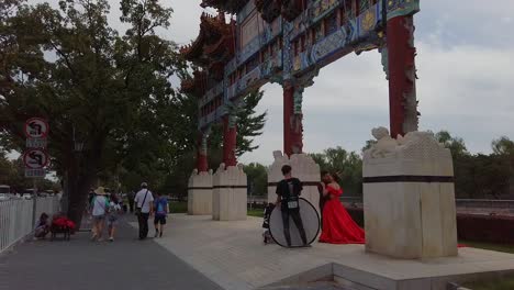 Tourists-walking-and-photo-session-shoot-happening-close-to-the-corner-of-the-moat-of-the-forbidden-city,-Beijing,-China