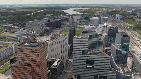 Flying-Over-Amsterdam-Zuidas-Business-District-In-Amsterdam,-The-Netherlands---Drone-Shot