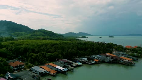 4K-Cinematic-nature-drone-footage-of-a-panoramic-aerial-view-of-the-beautiful-beaches-and-mountains-on-the-island-of-Koh-Lanta-in-Krabi,-South-Thailand,-on-a-sunny-day-over-the-old-town-of-Lanta