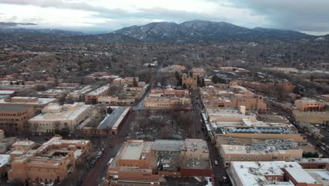 Santa-Fe,-New-Mexico-USA,-Aerial-View-of-Downtown-Buildings-and-Cathedral-on-Cloudy-Winter-Day,-Drone-Shot