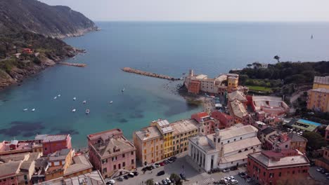 Sestri-levante,-showcasing-colorful-buildings-and-serene-coastal-waters,-aerial-view