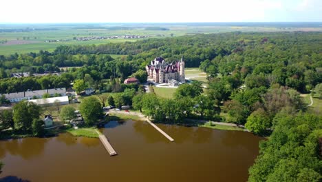 Moszna-Castle-In-Silesia,-Poland---Aerial-Pullback